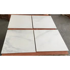 Four square polished or honed Oriental White Aurora Marble tiles for elegant flooring