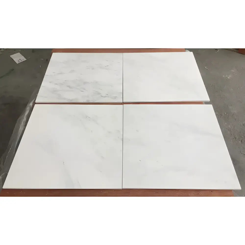 Four polished white marble tiles from Oriental Aurora Statuary Marble 12x12 inches