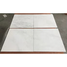 Four polished white marble tiles from Oriental Aurora Statuary Marble 12x12 inches
