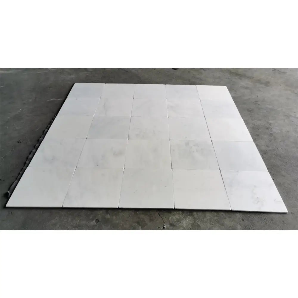 White square floor tiles from Oriental White Aurora Asian Statuary Marble 12x12 Tumbled