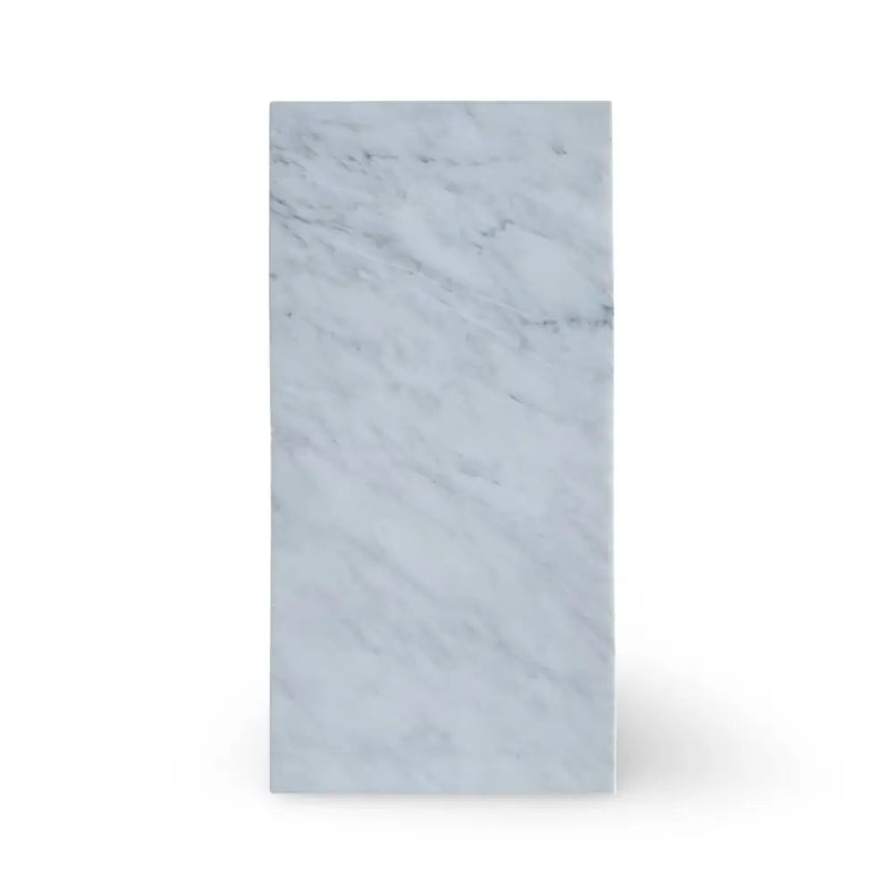 Rectangular Oriental White Aurora Asian Statuary Marble block on a polished surface