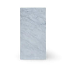 Rectangular Oriental White Aurora Asian Statuary Marble block on a polished surface