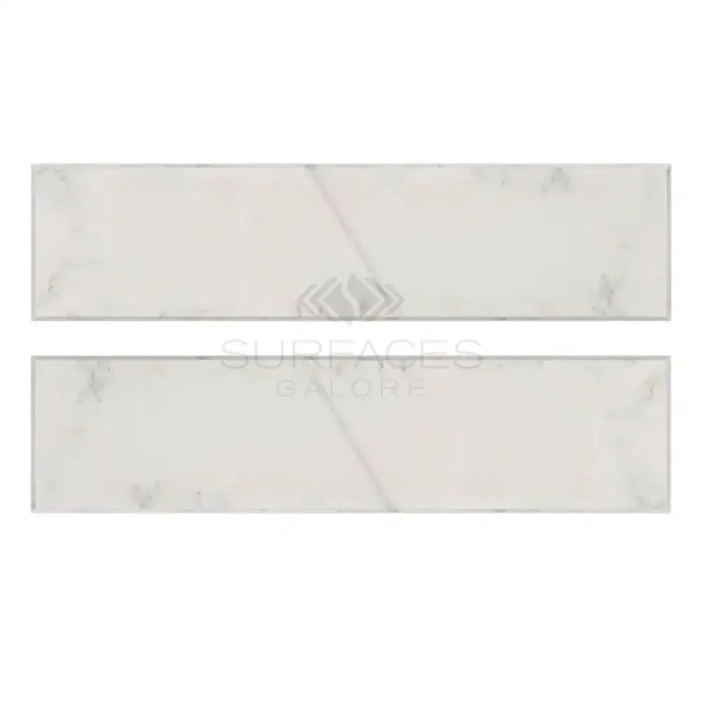 Two rectangular Oriental White Aurora Marble tiles with polished finish for flooring or walls