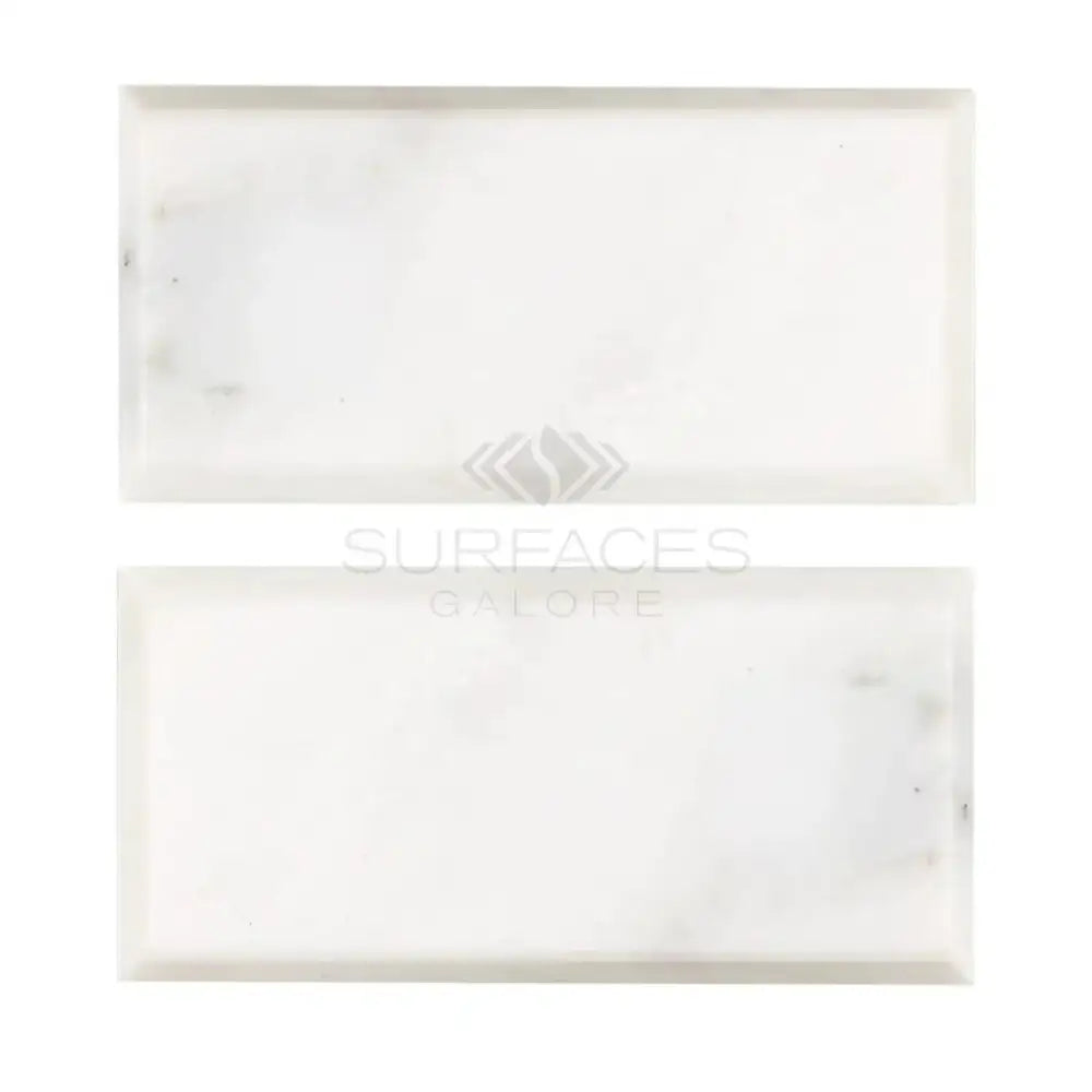 Two white marble tiles from Oriental White Aurora Asian Statuary Marble collection