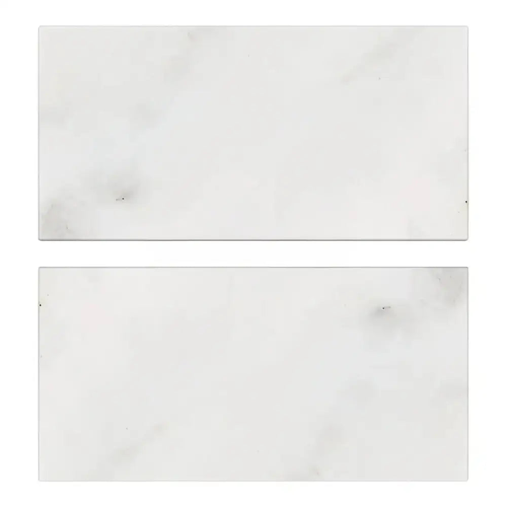 Two rectangular white marble tiles from Oriental White Aurora Asian Statuary Marble 3X6 Tumbled
