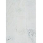 White marble tile arrangement of Oriental White Aurora Asian Statuary Marble 4x12