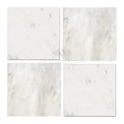 Four polished or honed Oriental White Aurora Asian Statuary Marble tiles in 4x4 size