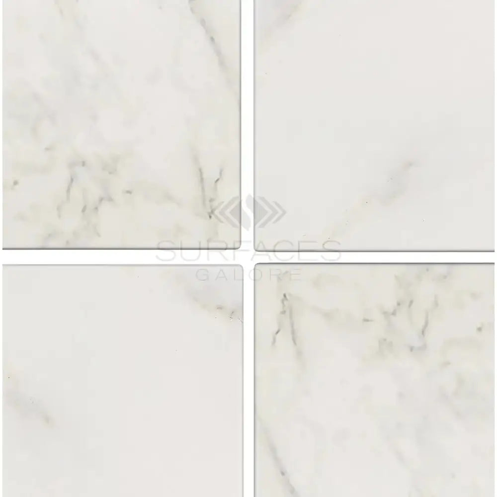 Four white marble tiles from Oriental White Aurora Asian Statuary Marble 4x4 Tumbled