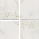 Four white marble tiles from Oriental White Aurora Asian Statuary Marble 4x4 Tumbled
