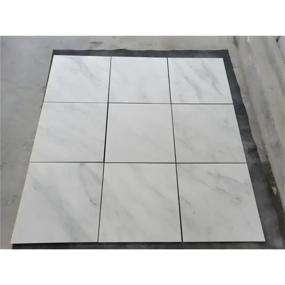 Nine white marble tiles from Oriental White Aurora Asian Statuary Marble 4X4 Tumbled