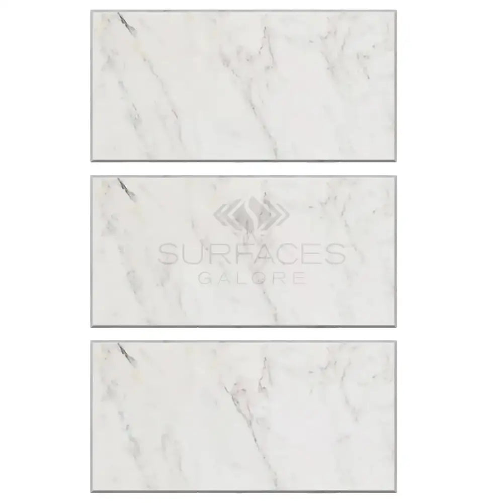 Three marble-patterned tiles from Oriental White Aurora Asian Statuary Marble collection