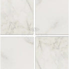 Four white marble tiles from Oriental White Aurora Asian Statuary Marble 6X6 Tumbled collection