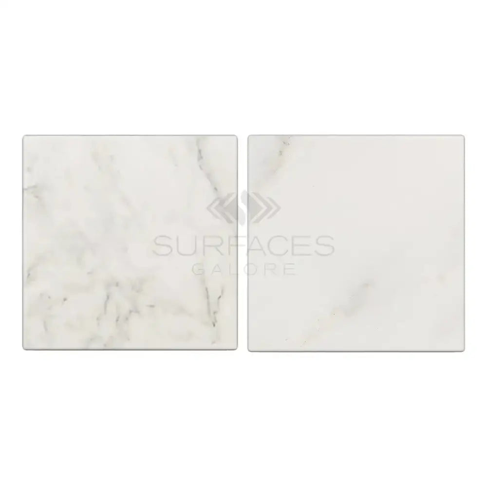 Two square Oriental White Aurora marble tiles in tumbled finish for elegant flooring