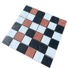Checkerboard mosaic tile sheet featuring Rojo Alicante, Carrara White, Royale White, and Nero Marquina