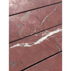 Red marble tiles with white veining in Rojo Alicante Select Marble 3x12 Field Tile