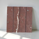 Red marble tiles with white veining from Rojo Alicante Select Marble 3x12 Field Tile