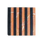 Striped marble tile displaying Rojo Alicante Select and Nero Marquina Prestige Marble mosaic