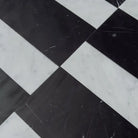 Black and white checkered marble floor from Siena in Carrara White Royale and Nero Marquina