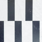 Black and white striped tile pattern from Siena Carrara White Royal and Nero Marquina Prestige set