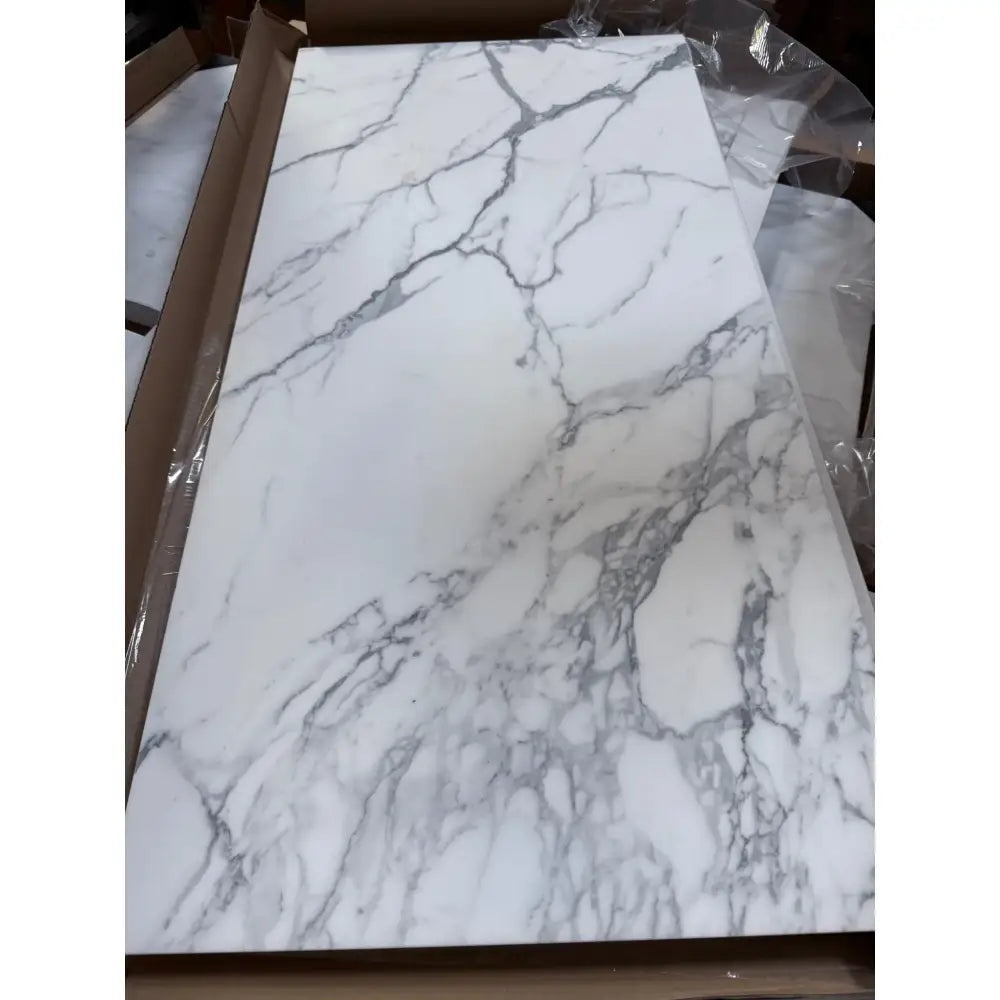 White marble-patterned surface from Statuary Statuario White 12X12 Italian Marble