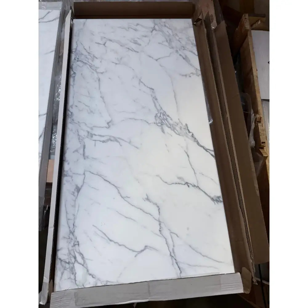 Marble-patterned countertop in cardboard packaging for Statuary Statuario White 12X12 Italian Marble
