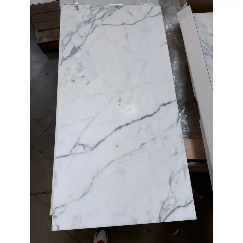 White marble-patterned tile from Statuary Statuario White 18X18 Italian Marble collection