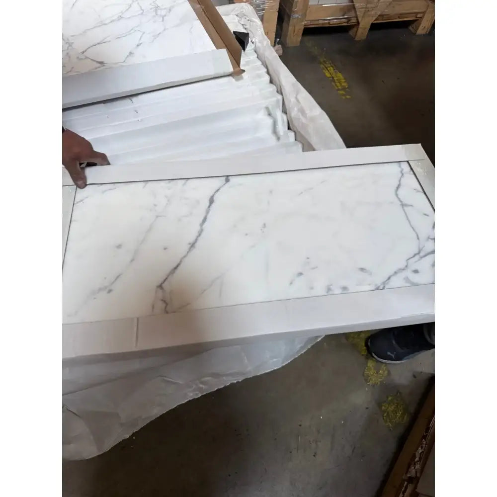 White marble-patterned tiles from Statuary Statuario White 18X18 Italian Marble