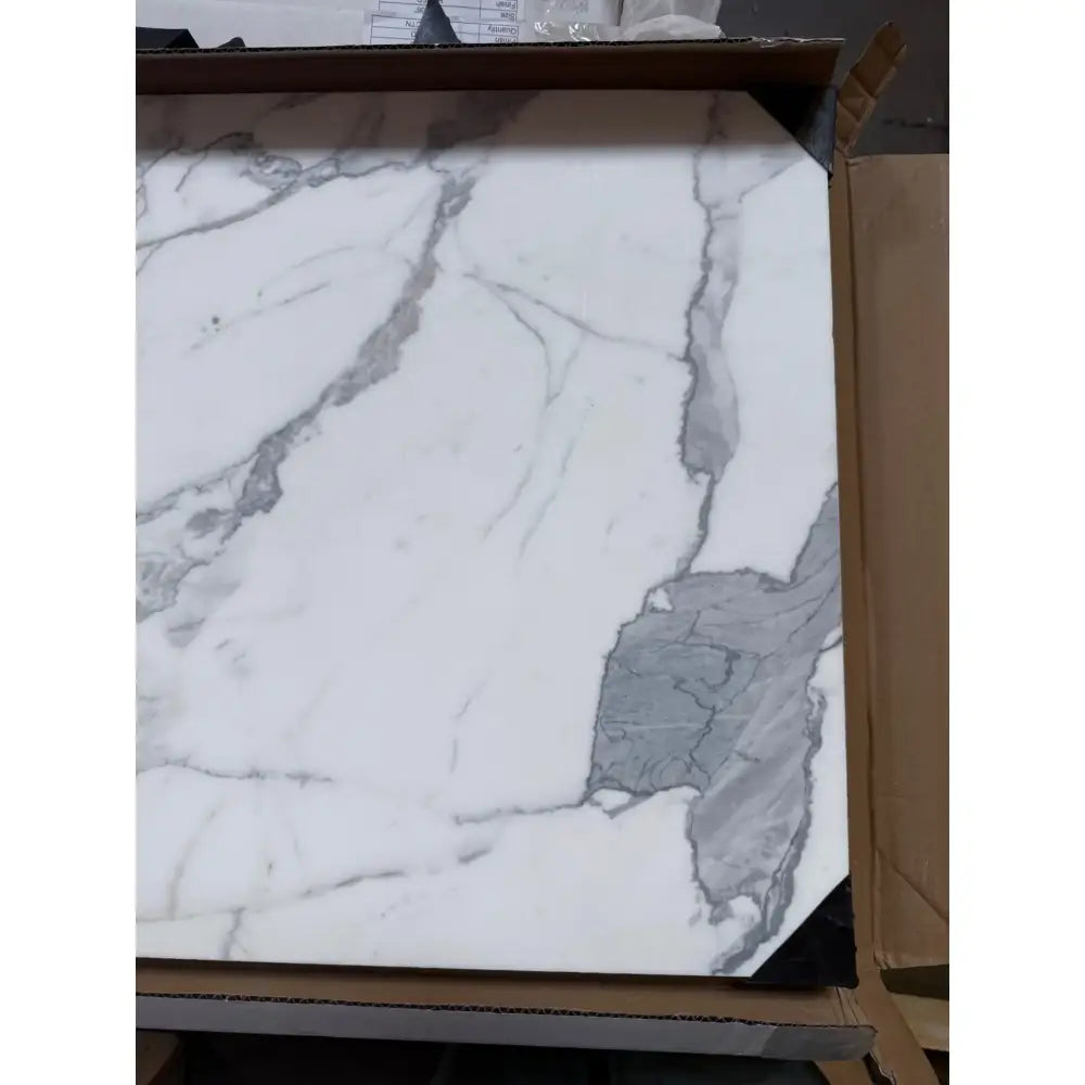 White marble tile with gray veining from Statuary Statuario White 18X18 Italian marble