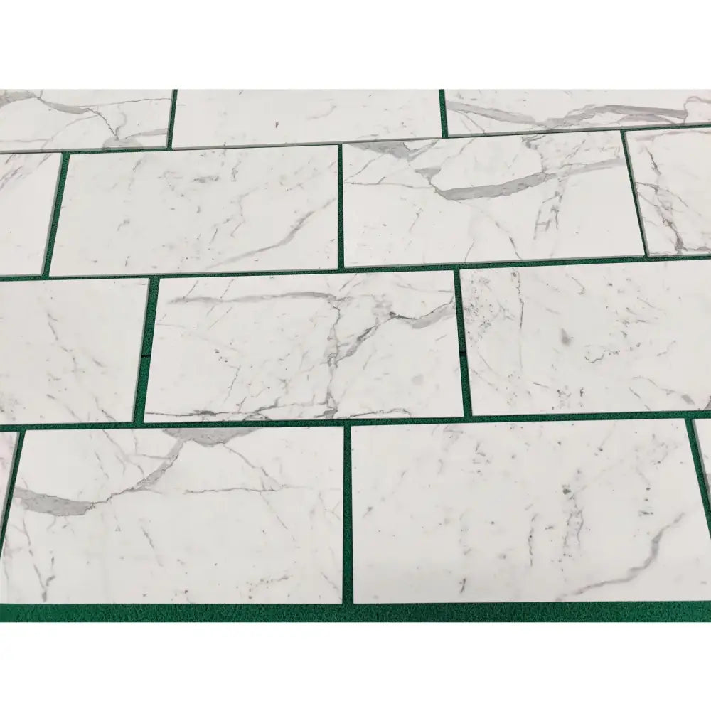 White marble-patterned rectangular tiles from Statuary Statuario White 4X12 collection