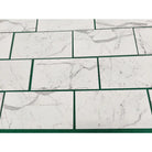 White marble-patterned rectangular tiles from Statuary Statuario White 4X12 collection