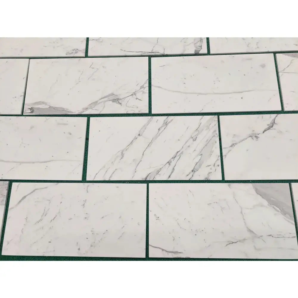 White marble-patterned tiles from Statuary Statuario White 4X12 Italian Marble