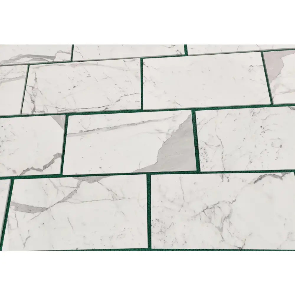 White marble-patterned tiles with green grout from Statuary Statuario White 4X12 Italian Marble