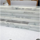 Stacked Statuary Statuario White 4X12 Italian Marble Tiles with MADE IN ITALY inscription