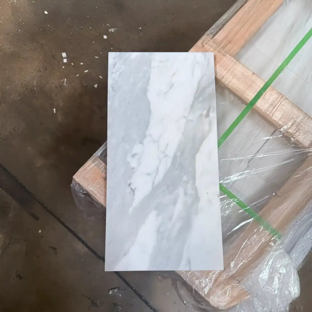 Rectangular marble-patterned tile from Statuary Statuario White 4X12 Italian Marble collection