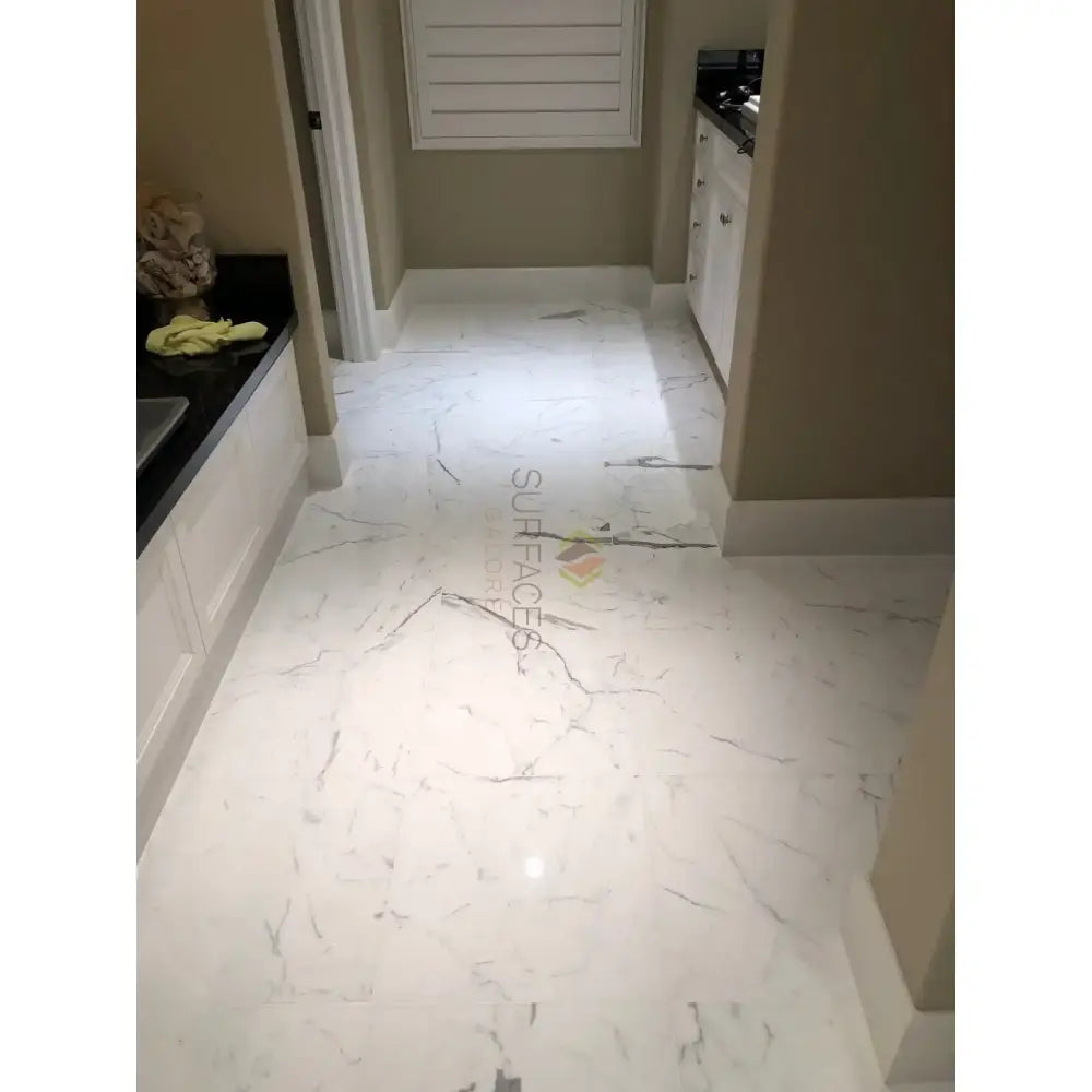 White marble-patterned flooring from Statuary Statuario White 4X12 Italian Marble