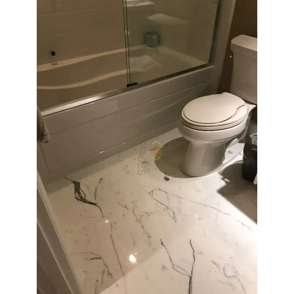 Bathroom with elegant marble floor featuring Statuary Statuario White 4X12 Italian Marble