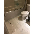 Bathroom with elegant marble floor featuring Statuary Statuario White 4X12 Italian Marble