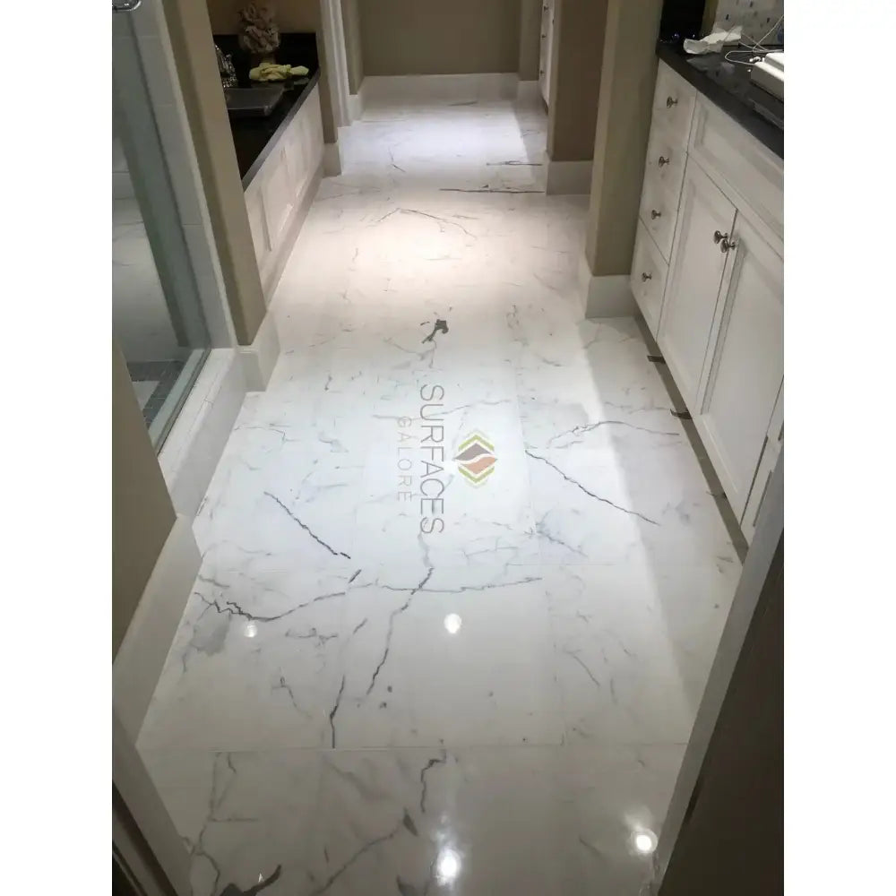 White marble floor with gray veining from Statuary Statuario White 4X12 Italian Marble