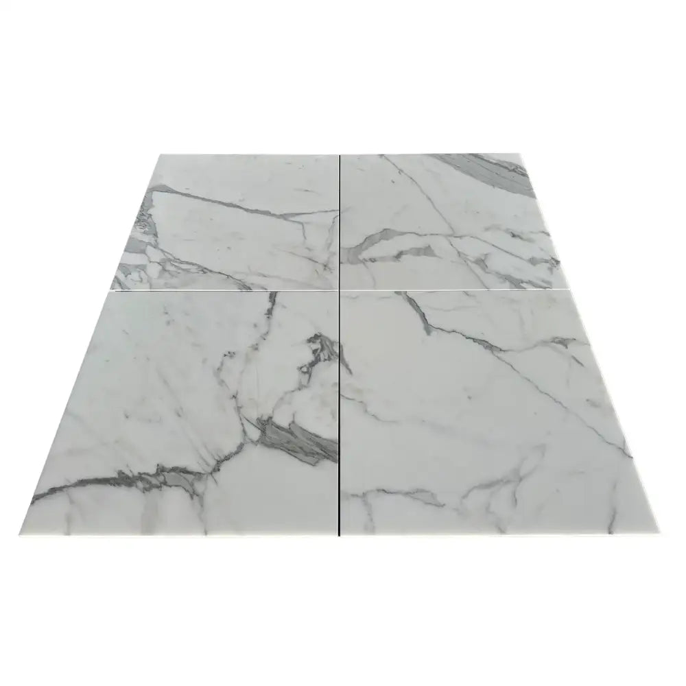 Four marble-patterned tiles from Statuary Statuario White 4X12 Italian Marble collection