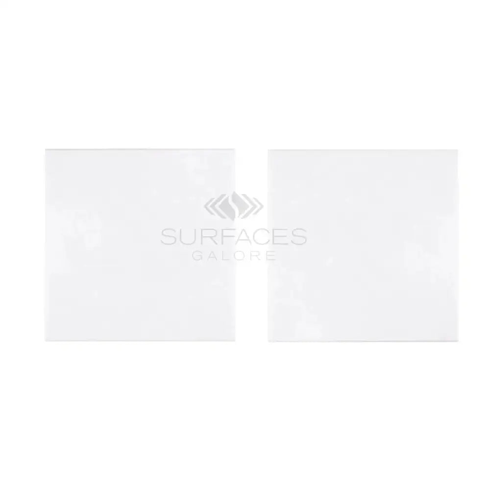 Two white Thassos Supreme 12x12 marble tiles in polished or honed finish