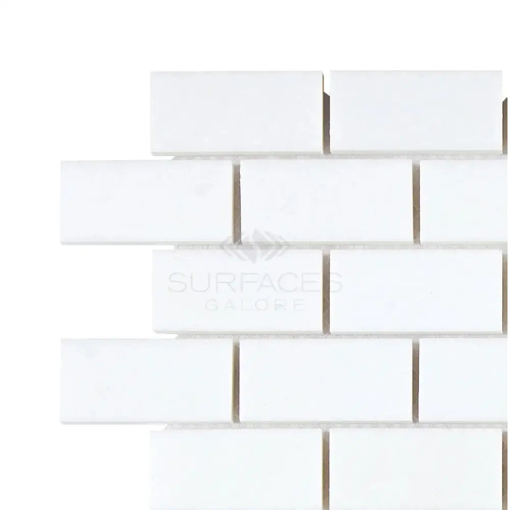 White subway tile from Thassos Supreme 1X2 Brick Mosaic Marble polished or honed