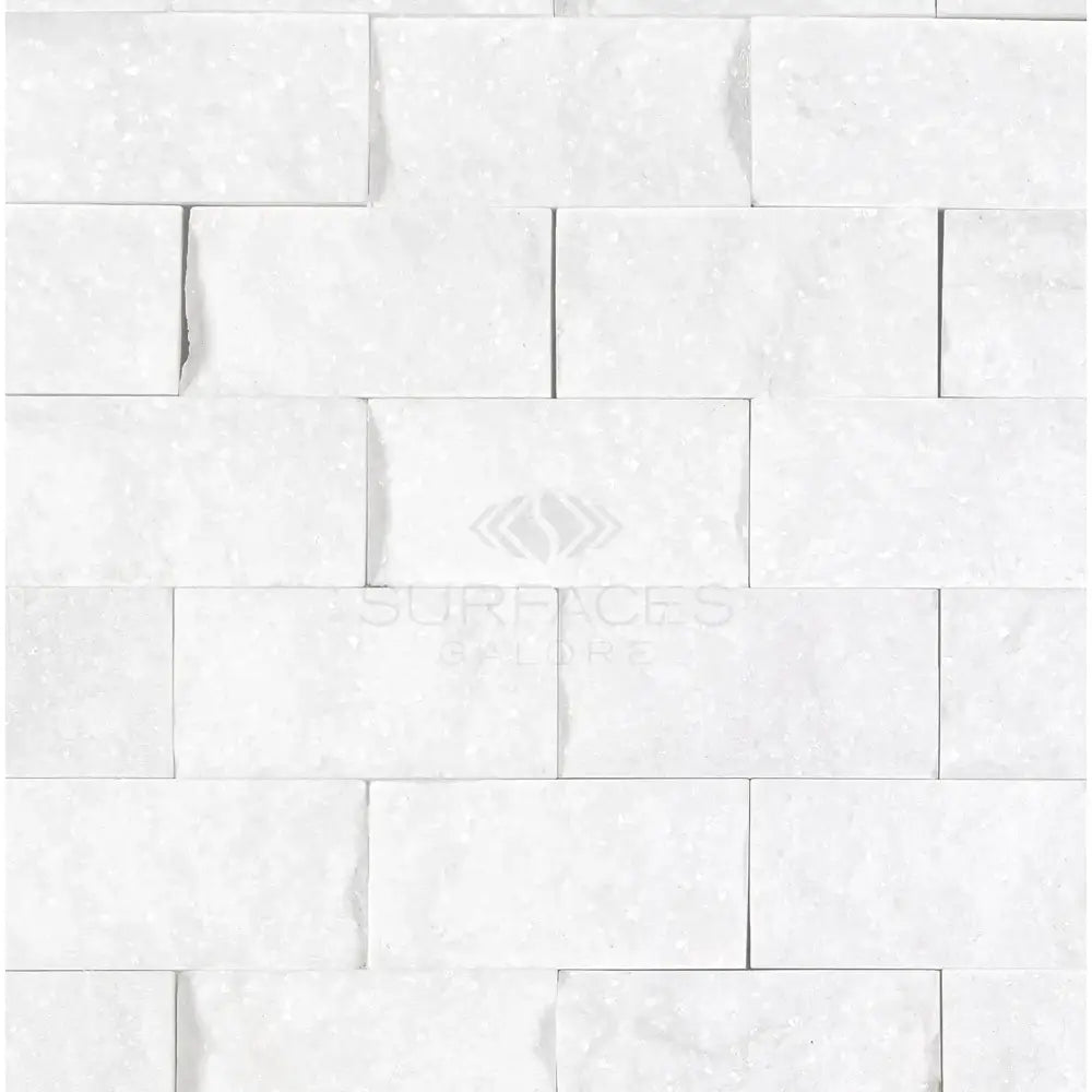 White stacked stone wall in Thassos Supreme 1X2 Brick Mosaic Marble Split-Faced
