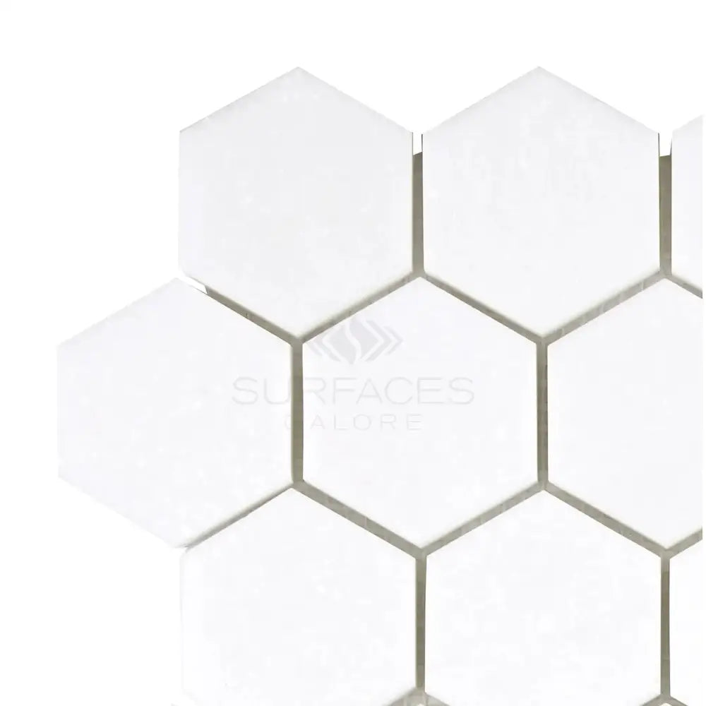 White hexagonal tile pattern in Thassos Supreme 2 inch Hexagon Mosaic Marble