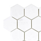 White hexagonal tile pattern in Thassos Supreme 2 inch Hexagon Mosaic Marble