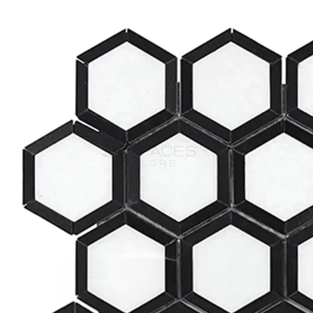 Black and white hexagonal tile pattern in Thassos Supreme Vortex Mosaic Marble