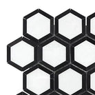 Black and white hexagonal tile pattern in Thassos Supreme Vortex Mosaic Marble