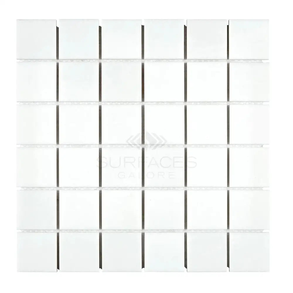 White square mosaic tile sheet from Thassos Supreme 2X2 Marble for elegant surfaces