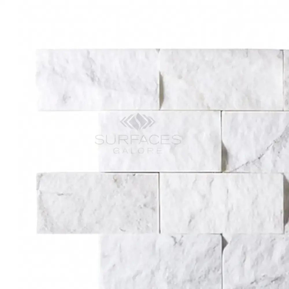 White marble brick wall featuring Thassos Supreme 2X4 Brick Mosaic Split-Faced design