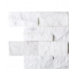 White marble brick wall featuring Thassos Supreme 2X4 Brick Mosaic Split-Faced design