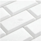 White rectangular beveled marble tiles from Thassos Supreme 2X4 Deep-Beveled Brick Mosaic collection